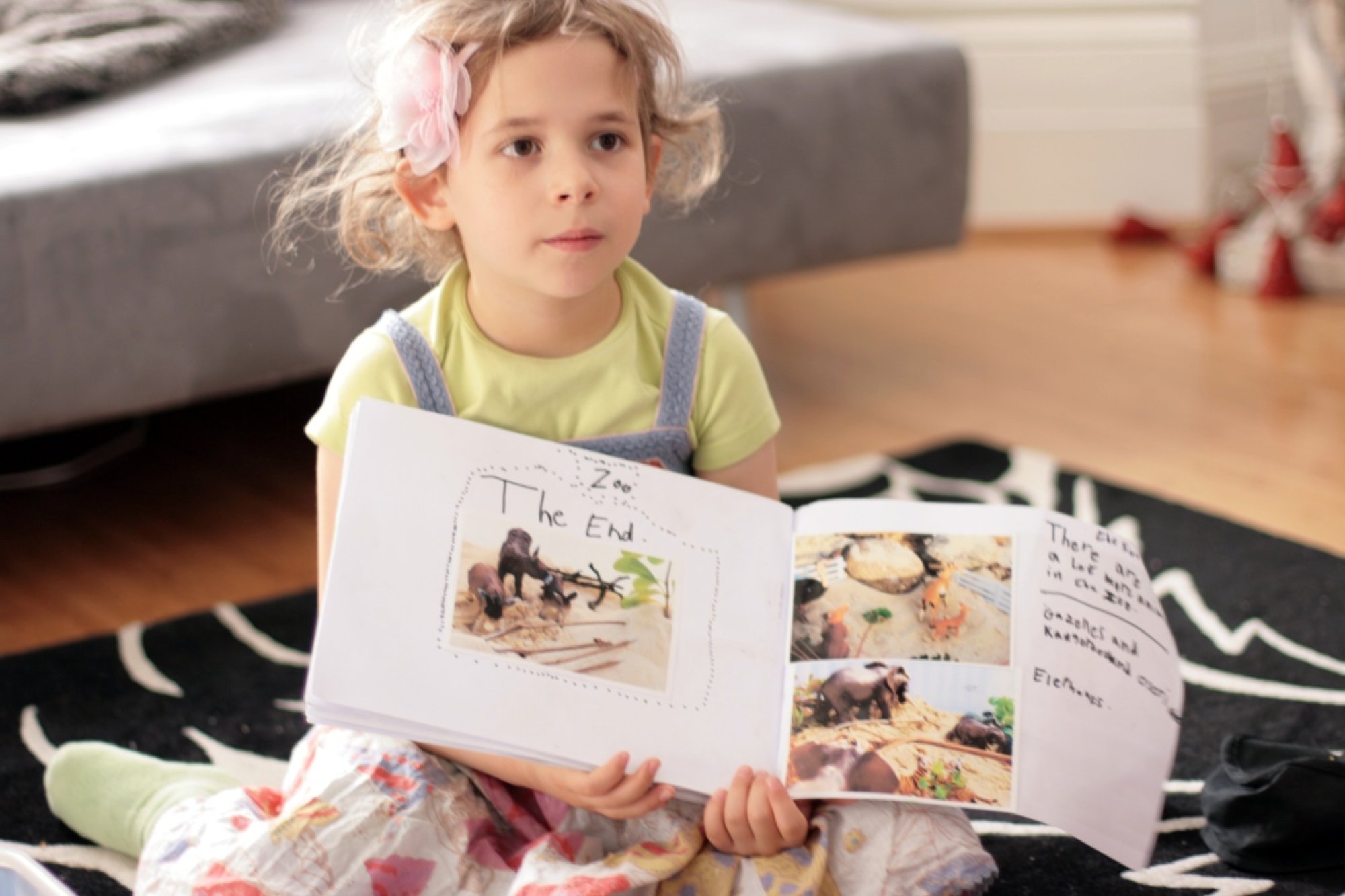 Ava reading her zoo storybook