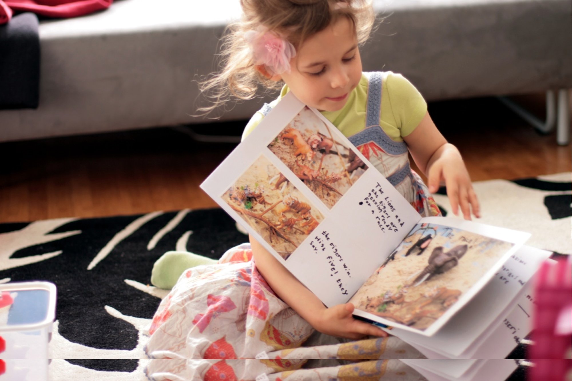 Ava with her zoo storybook