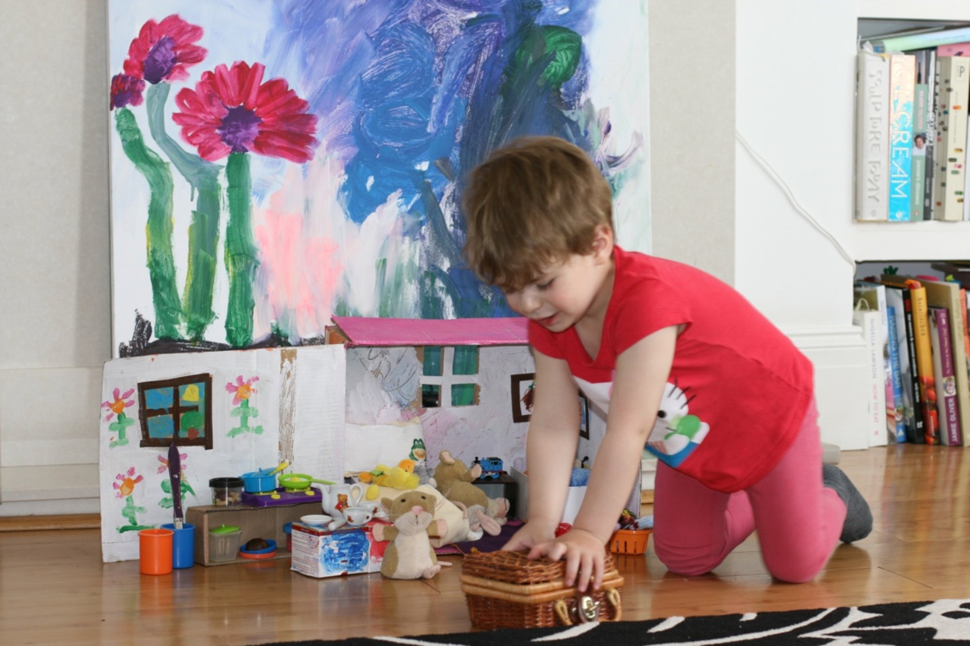 Marlon playing with the Hoover-Mouse house