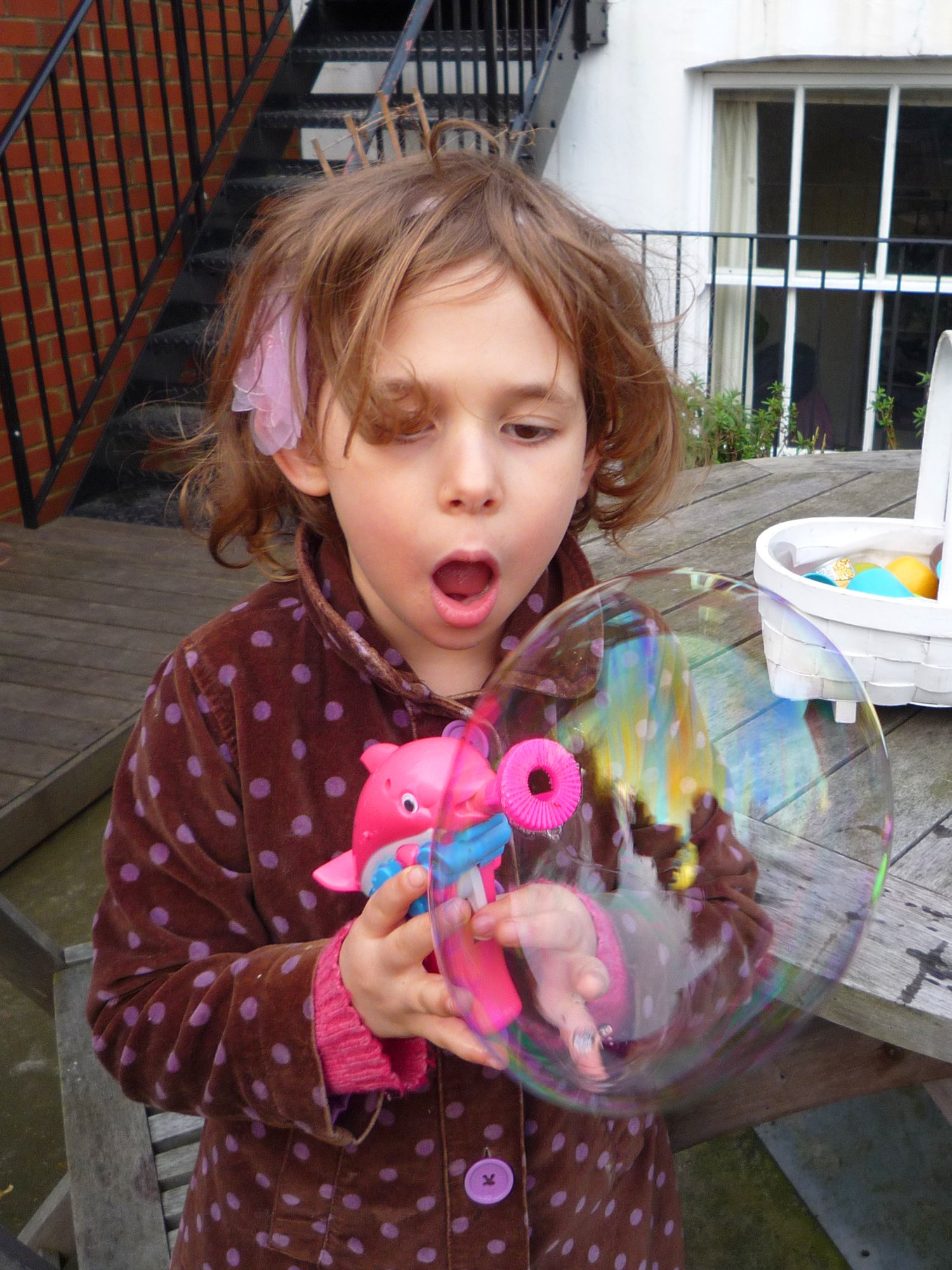 Ava amazed by a giant bubble