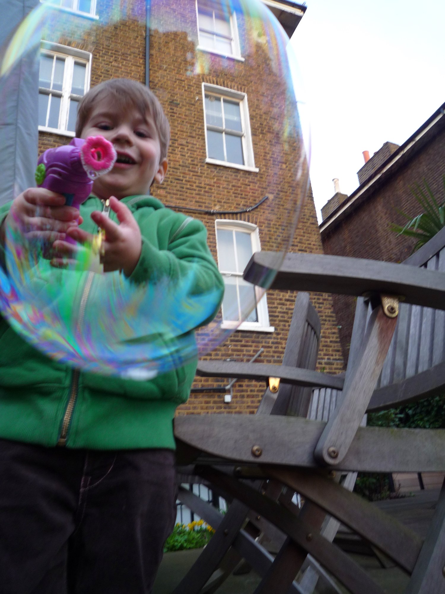 Marlon grinning through a bubble